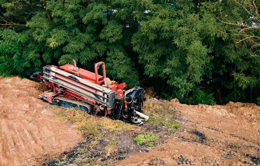 Trenchless machine in muddy field